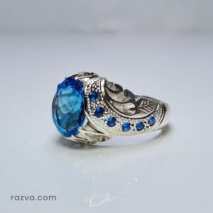 Bague homme pierre précieuse bleue avec monture argent travaillée